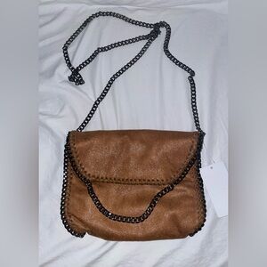 NWT brown vegan leather chain purse. Never used. No flaws.
